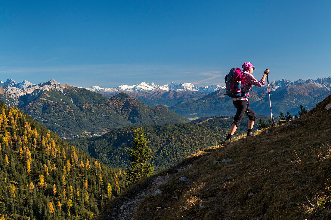 mountain hiking on the southern slopes of the Wetterstein mountains, autumn, view on Zillertal Alps and Olperer summit, Tyrol, Austria, Europe