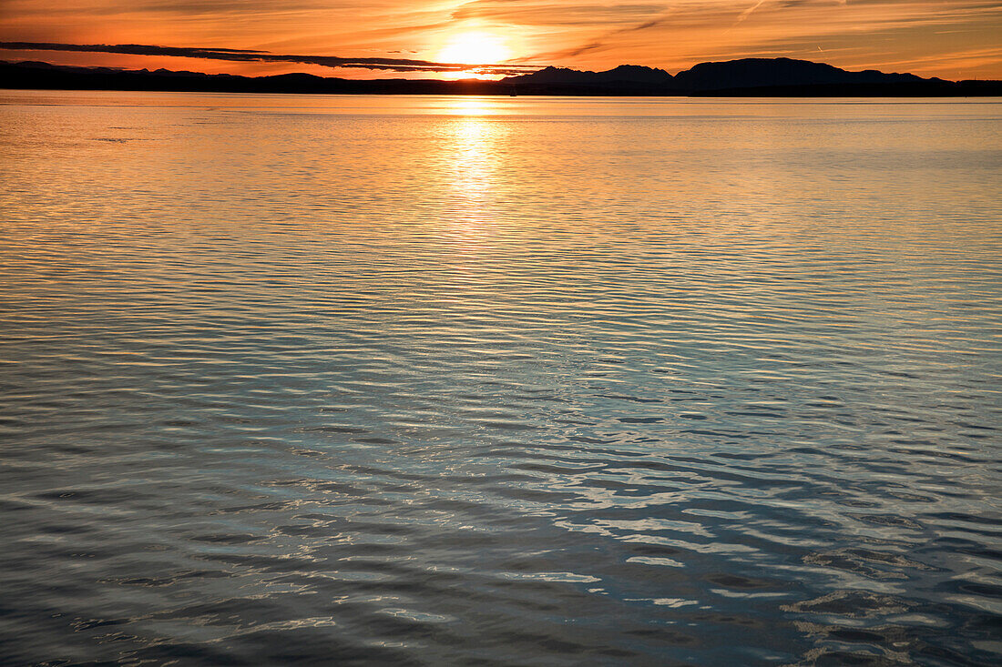 CANADA, Vancouver BC, Sunset off the Holland America cruise ship, the Oosterdam, while it cruises the Inside Passage from Vancouver BC to Ketchikan, Georgia Straight, British Columbia