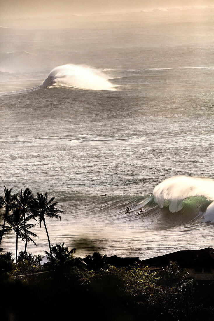 HAWAII, Oahu, North Shore, Eddie Aikau, 2016, locals surfing at Waimea Bay after the Eddie Aikau 2016 surf competition had ended, Waimea Bay