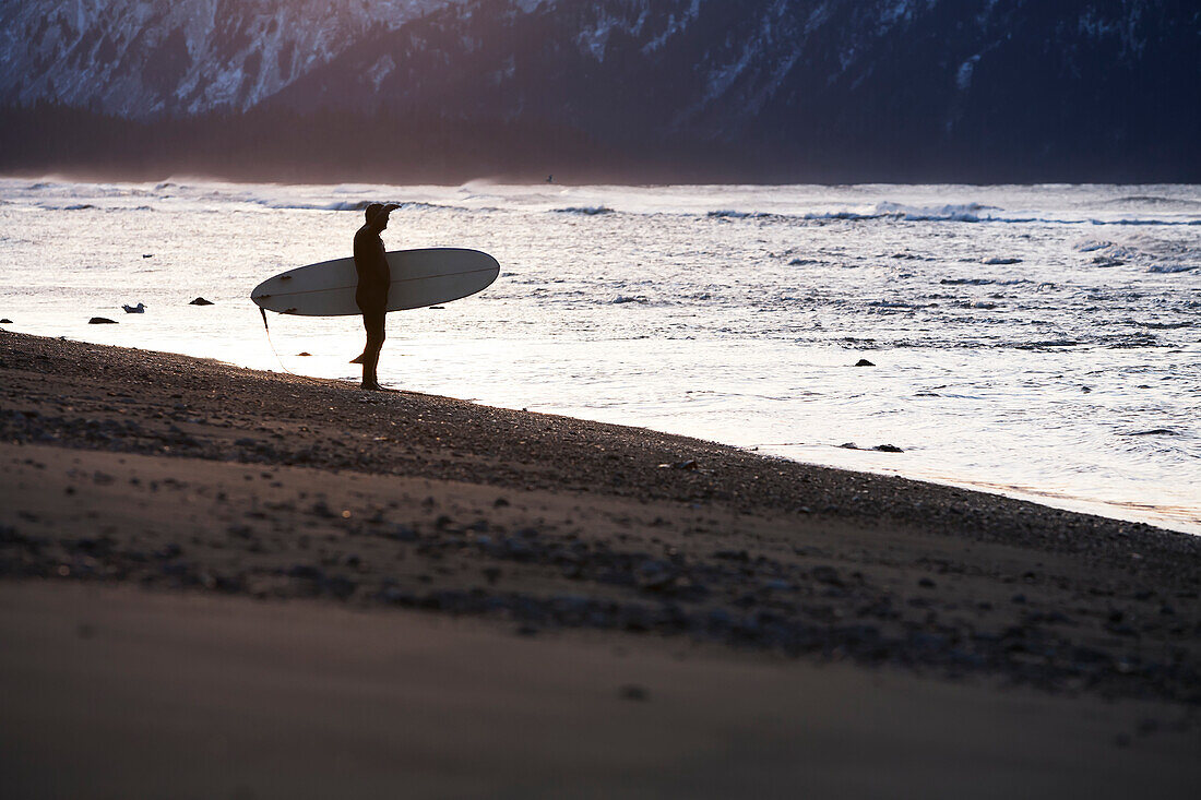 Surfer On The Shores Of Kachemak Bay, Homer Spit, Southcentral Alaska, USA