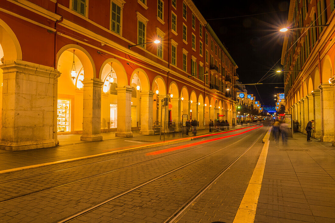 Red Light Trail Of Train Lights Down A Street; Nice, Cote D'azur, France