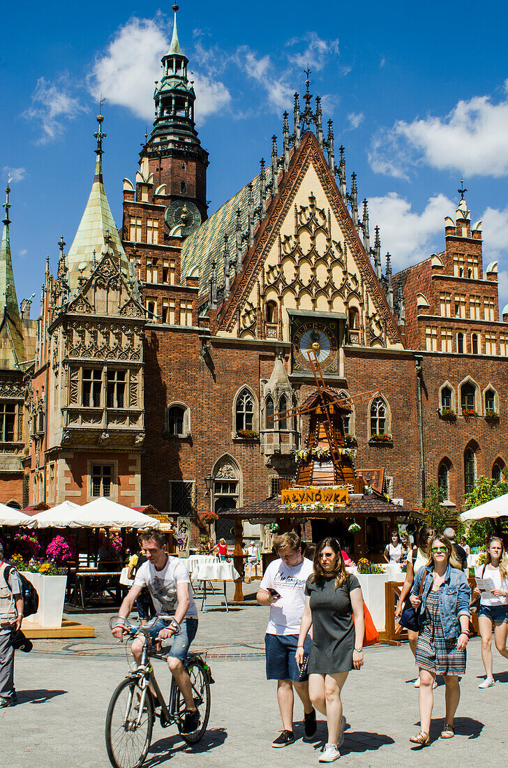 Old Town Hall, Astronomical Clock And People Strolling On Market Square; Wroclaw, Poland