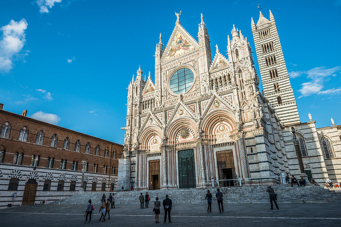 Front Facade Of The Ancient White And Red Marble Siena Cathedral; Siena, Italy