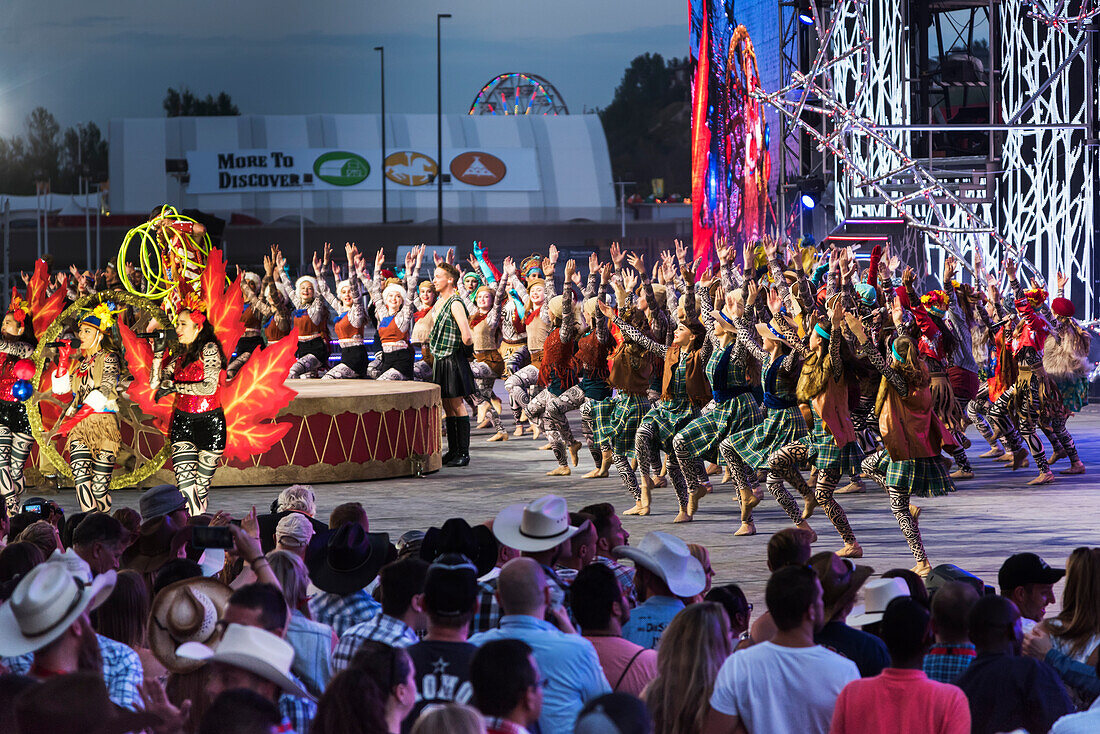 Dancers entertaining a crowd at the Calgary Stampede; Calgary, Alberta, Canada