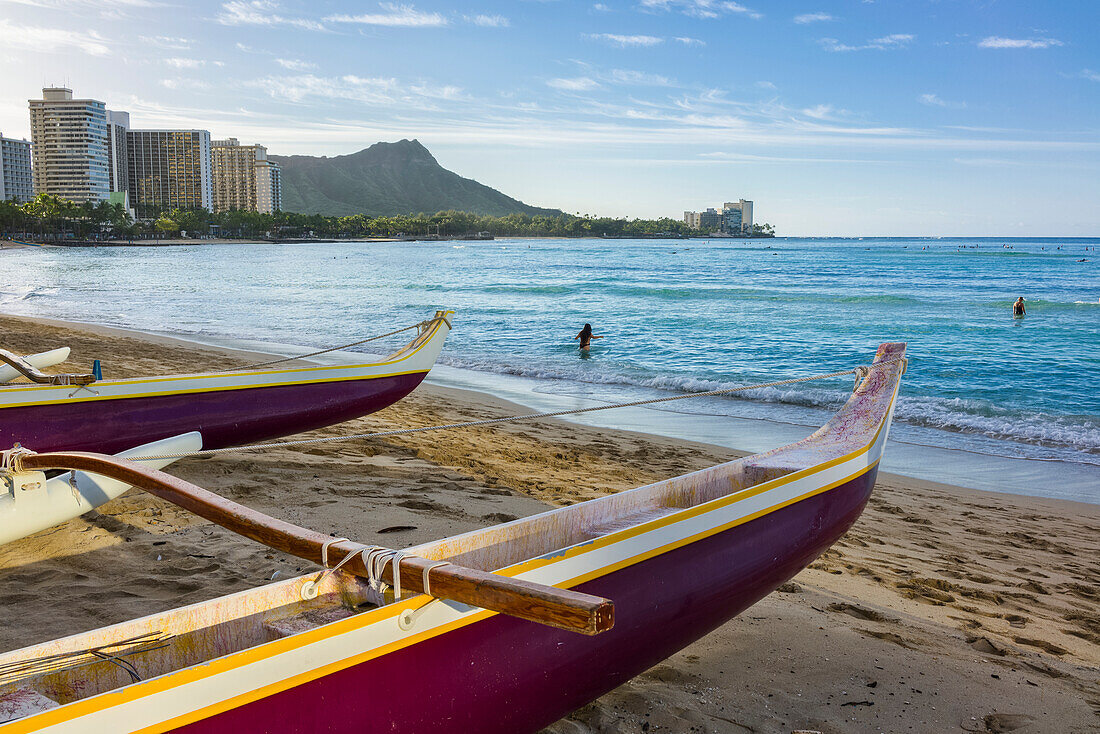 Outrigger canoes, Waikiki and Diamond Head on the island of Oahu; Honolulu, Oahu, Hawaii, United States of America