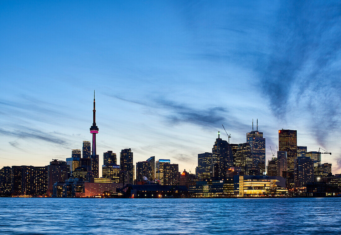 Skyline Of Toronto At Sunset With Lake Ontario In The Foreground; Toronto, Ontario, Canada