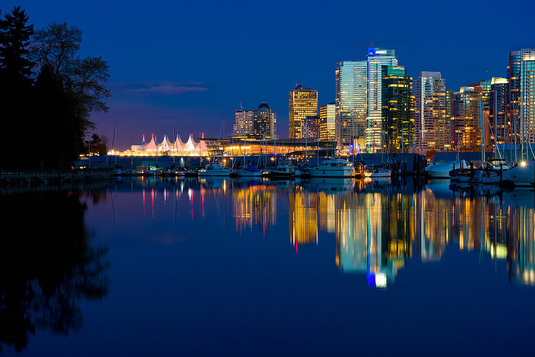 Reflection Of Vancouver's Skyline In The Evening; Vancouver, British Columbia, Canada