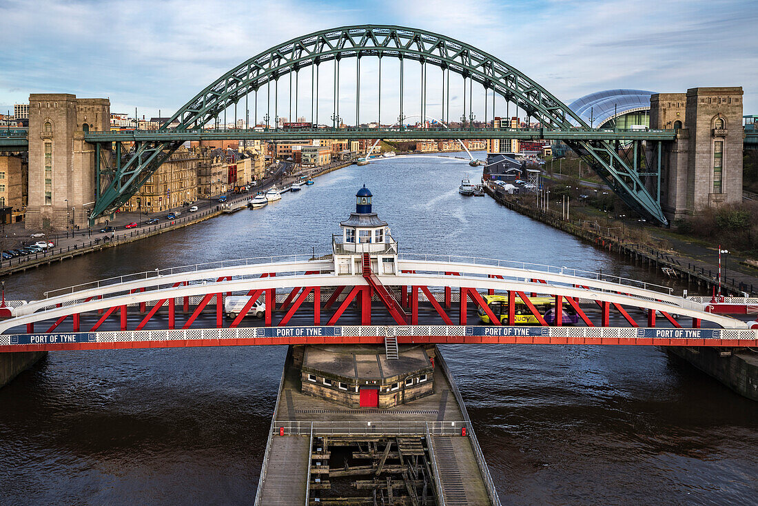 Three of the seven bridges across the river Tyne joining Newcastle upon Tyne and Gateshead, Swing Bridge (1876), the Tyne Bridge (1928) and the Gateshead Millennium Tyne and Wear, England