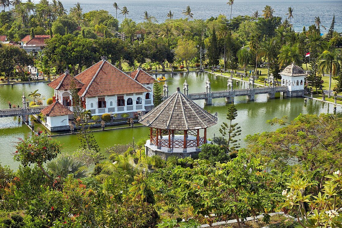 Gili Bale, main building of the Ujung Water Palace (Taman Ujung), surrounded by water and landscaped garden. Karangasem Regency, Bali, Indonesia.