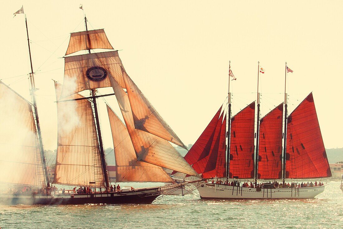 Two antique sailing schooners crossing paths in San Diego Bay, California