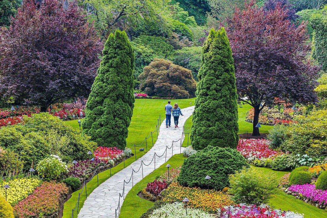 Tourists in Butchart Gardens in Victoria, British Columbia, Canada a National Historic Site of Canada.