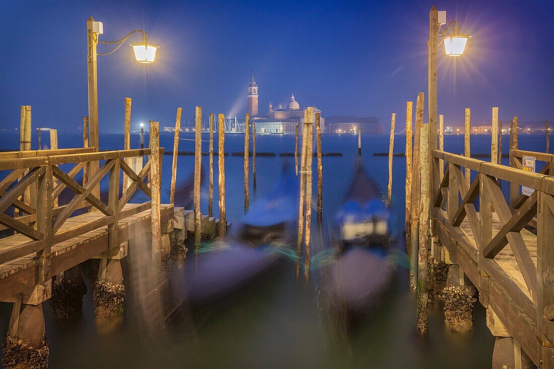 Europe, Italy, Veneto, Venice. Night landscape towards the island of San Giorgio with the gondolas.