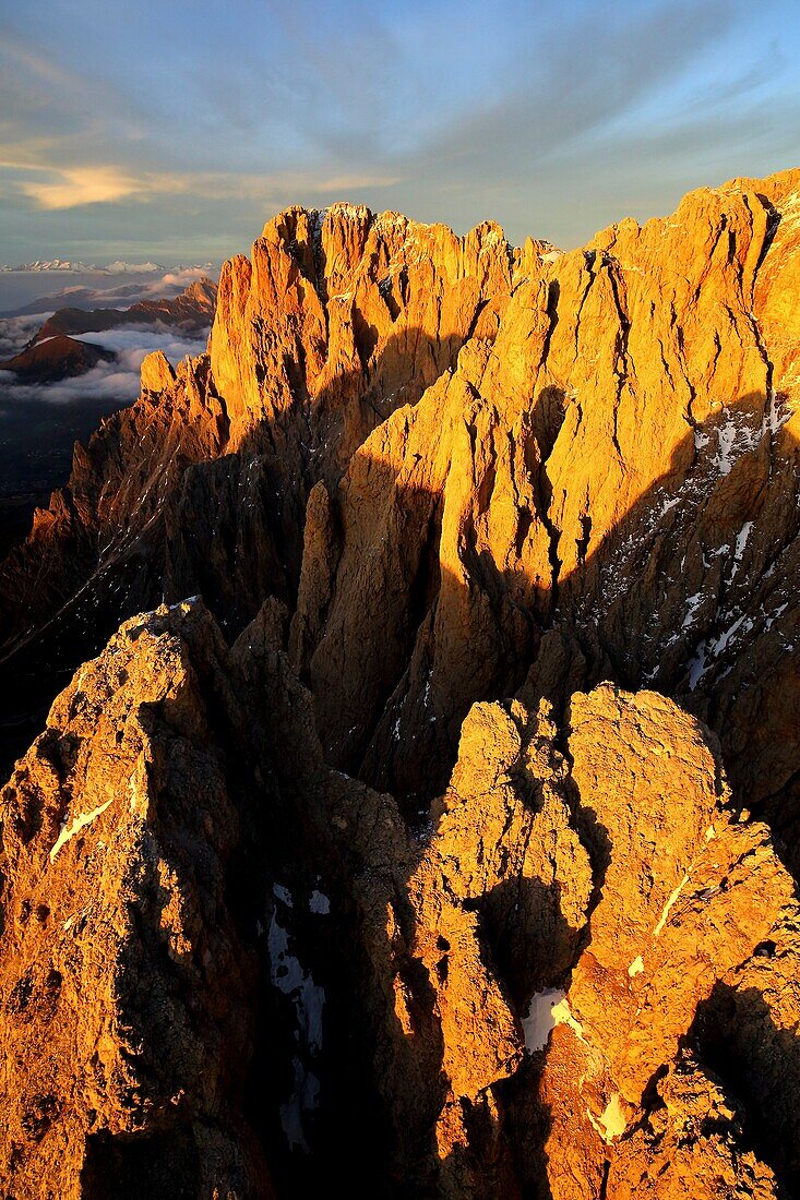 Aerial shot of Sassolungo and Sassopiatto at sunset. Sella Group Val Gardena. Dolomites Trentino Alto Adige Italy Europe.