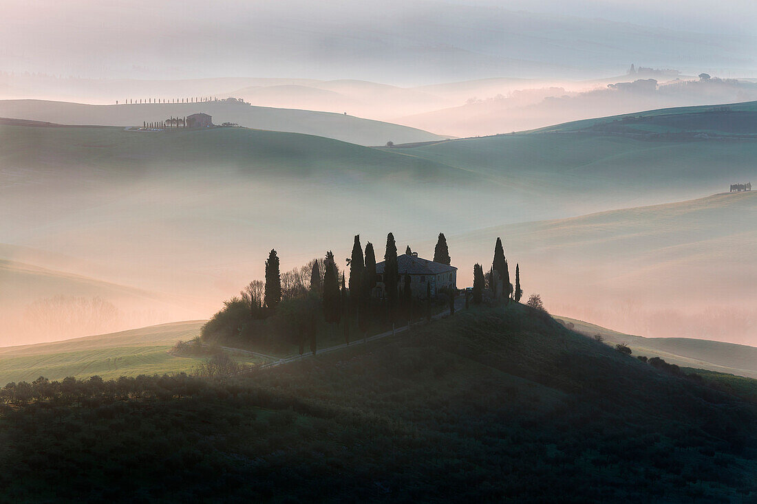 red sunrise in the hills, san Quirico d'orcia, val d'orcia, siena, tuscany, italy