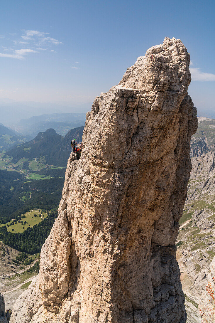 Climbers at Delago tower. Torri del Vajolet, Dolomites, Trentino, Italy.