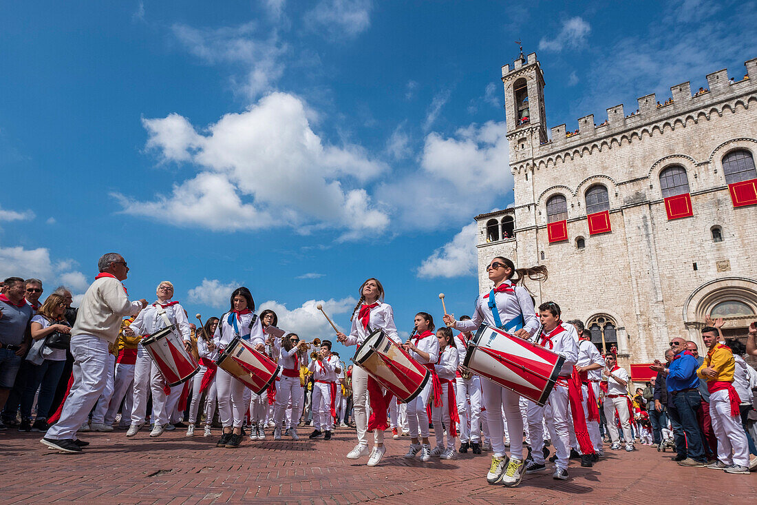 Italy, Umbria, Gubbio, Band in Signoria Square(Piazza Grande) during Ceri Festival