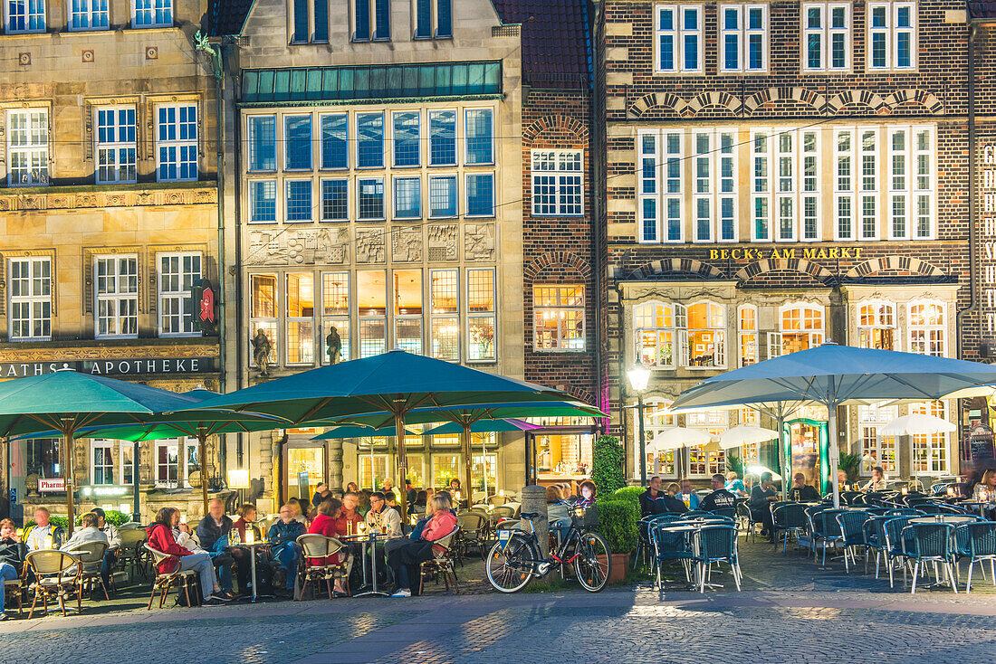 Bremen, Bremen State, Germany. Cafes and the old buildings in Marktplatz in the evening.
