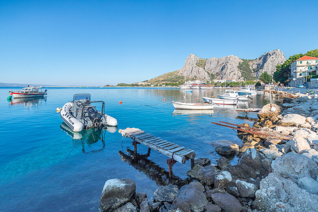 Small boats moored on the waterfront of Omis, Dalmatia, Adriatic Coast, Croatia