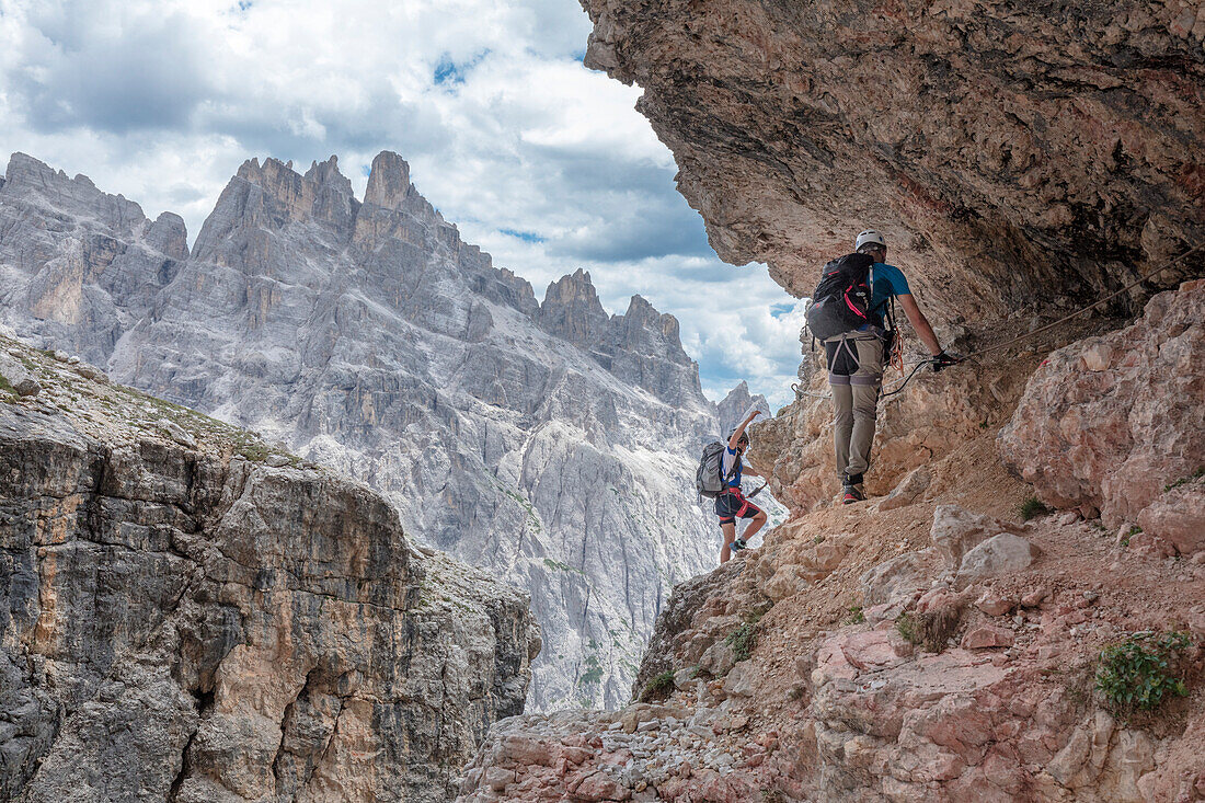 Climbers on the via ferrata Cengia Gabriella, Popera group, Giralba, Sexten Dolomites, Belluno, Veneto, Italy