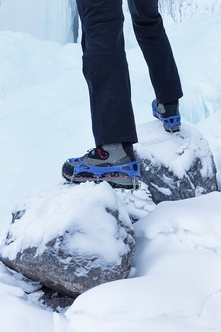 detail of a winter footwear with mounted trekking crampons, Agordino, Dolomites, Belluno, Veneto, Italy