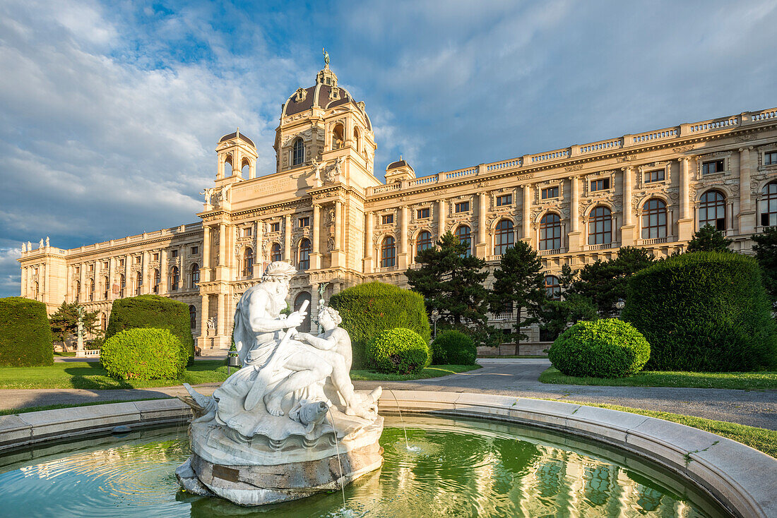 Vienna, Austria, Europe. Tritons and Naiads fountain on the Maria Theresa square with the Natural History Museum in the background