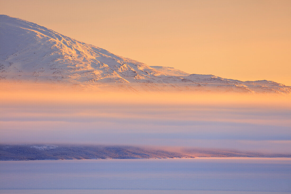 Panoramic of sunrise on the snowy landscape, Bjorkliden, Abisko, Kiruna Municipality, Norrbotten County, Lapland, Sweden