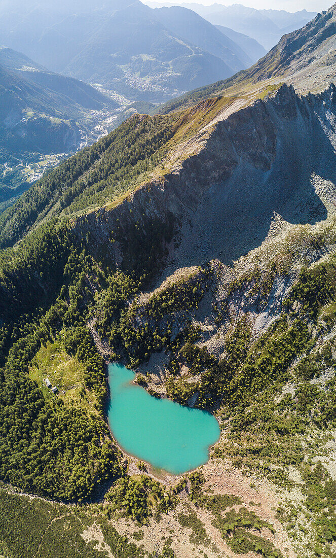 Panoramic of turquoise Lago Lagazzuolo from drone, Chiesa In Valmalenco, Province of Sondrio, Valtellina, Lombardy, Italy