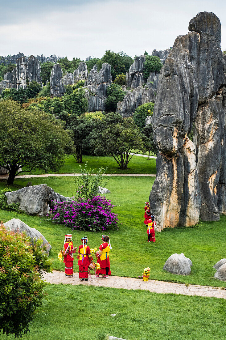 Sani minority girls with traditional dress at Stone Forest or Shilin, Kunming, Yunnan Province, China, Asia, Asian, East Asia, Far East