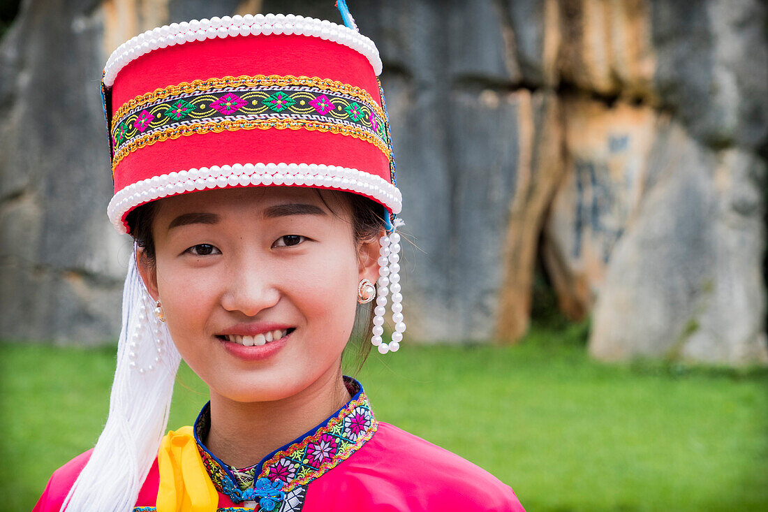 Sani minority girl with traditional dress at Stone Forest or Shilin, Kunming, Yunnan Province, China, Asia, Asian, East Asia, Far East