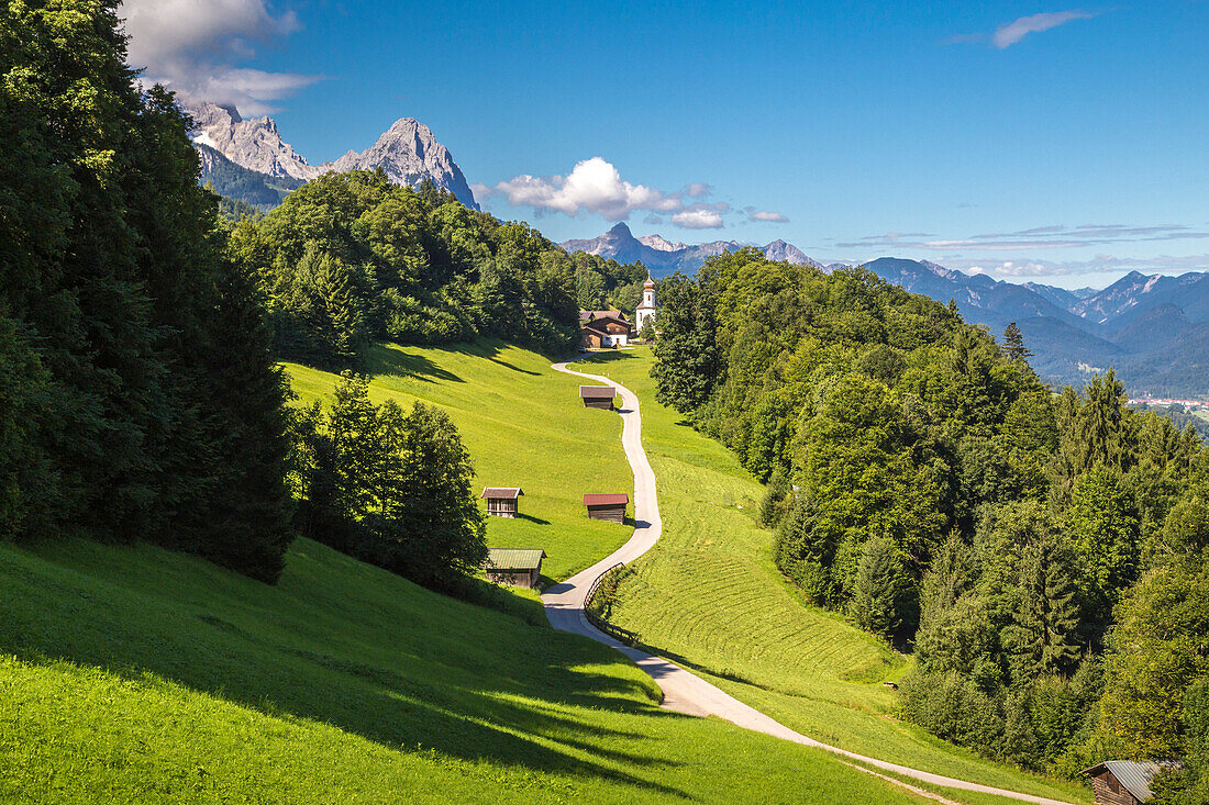 Wamberg village with Mount Zugspitze and Waxenstein on the background, Garmisch Partenkirchen, Bayern, Germany