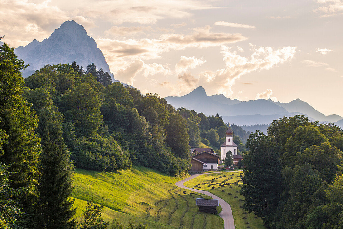 The iconic Wamberg Church, with Mount Waxenstein on the background, Wamberg, Garmisch Partenkirchen, Bayern, Germany