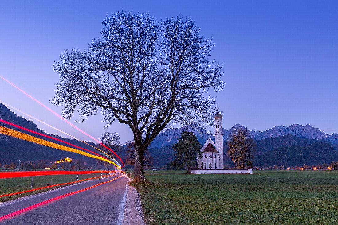 Sunrise on St Coloman Church surrounded by woods, Schwangau, Fussen, Bavaria, Southwest Bavaria, Germany, Europe