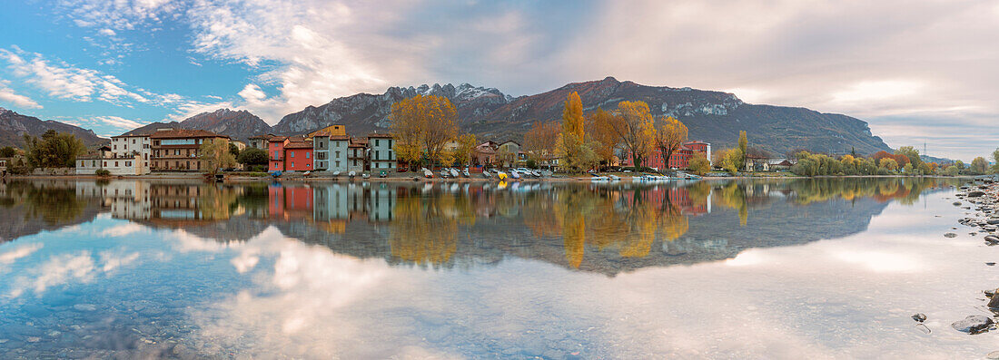 Pescarenico and Resegone mount reflected on the river Adda, Lecco, Lecco province, Lombardy, Italy