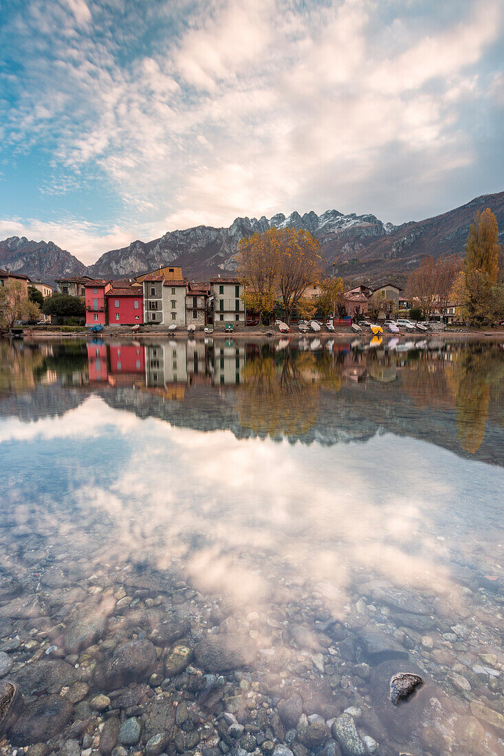 Pescarenico and Resegone mount reflected in the river Adda, Lecco, Lecco province, Lombardy, Italy