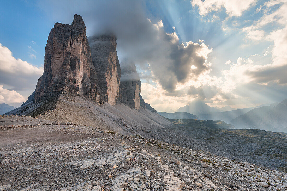 Sunset with clouds on Tre Cime di Lavaredo as seen from Lavaredo fork, Sexten Dolomites, Italy