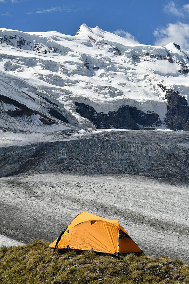 Camping on the ridge of moraine, close to the Grand Combin glacier, Grand Combin on background,Switzerland,Swiss