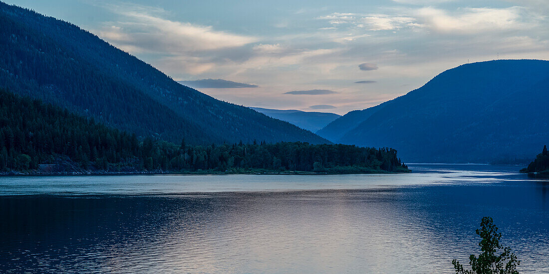 Landscape of mountains and Kootenay Lake at sunset; Kaslo, British Columbia, Canada