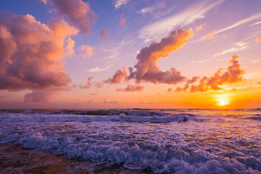 Sunrise over the Atlantic Ocean with the surf washing up on the shore; Indialantic, Florida, United States of America