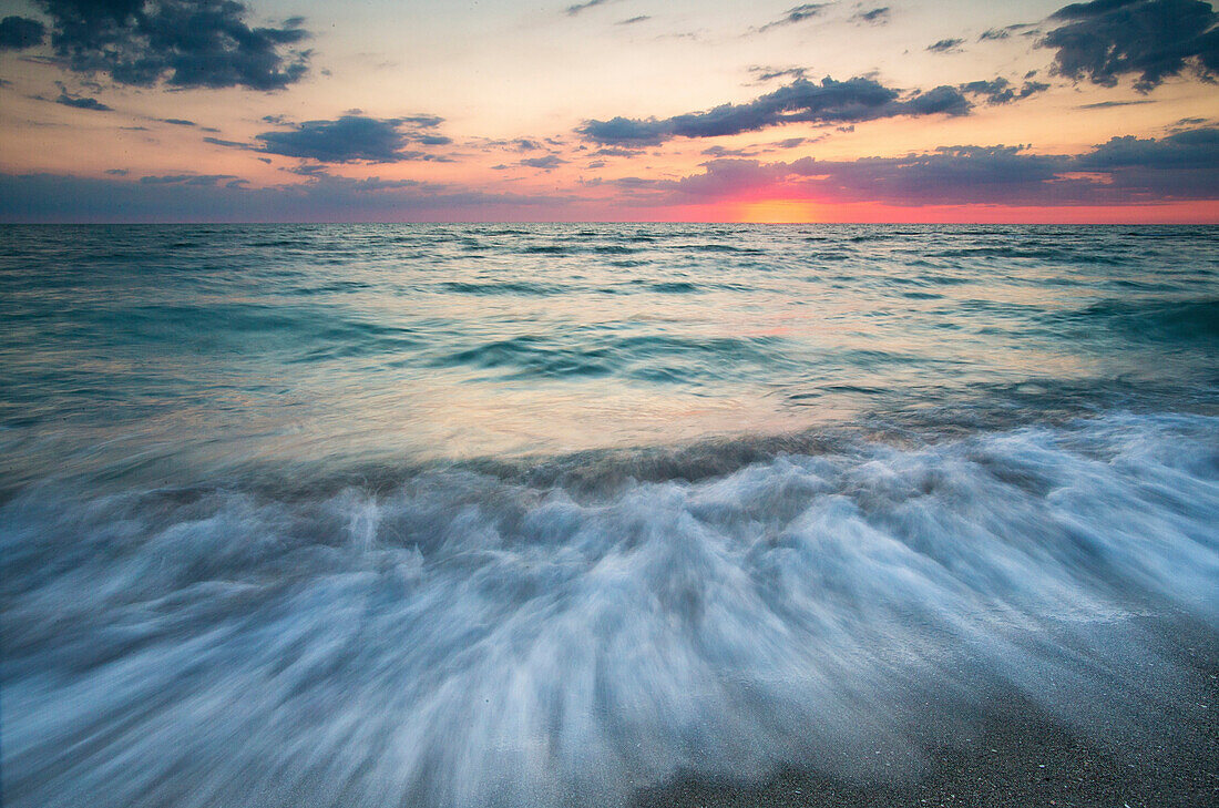 Long exposure of Gulf of Mexico coast at scenic sunset, Florida, USA