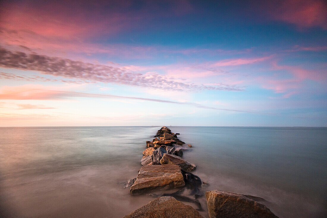 Nantucket Jetty at sunset at entrance of Nantucket Harbor, Massachusetts, USA