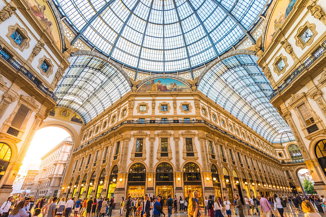 Galleria Vittorio Emanuele II, Milan, Lombardy, Italy. Tourists walking in the world's oldest shopping mall.