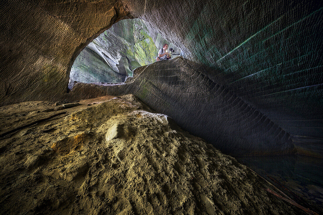 One man inside a cave of molera stone, valle del lanza, Malnate, Varese province, Lombardy, Italy, Europe