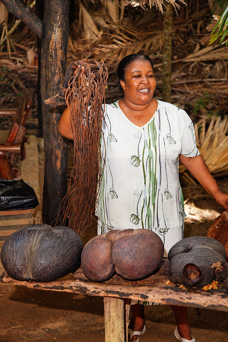 Local tour guide with Coco De Mer, Vallee de Mei, Praslin, Seychelles