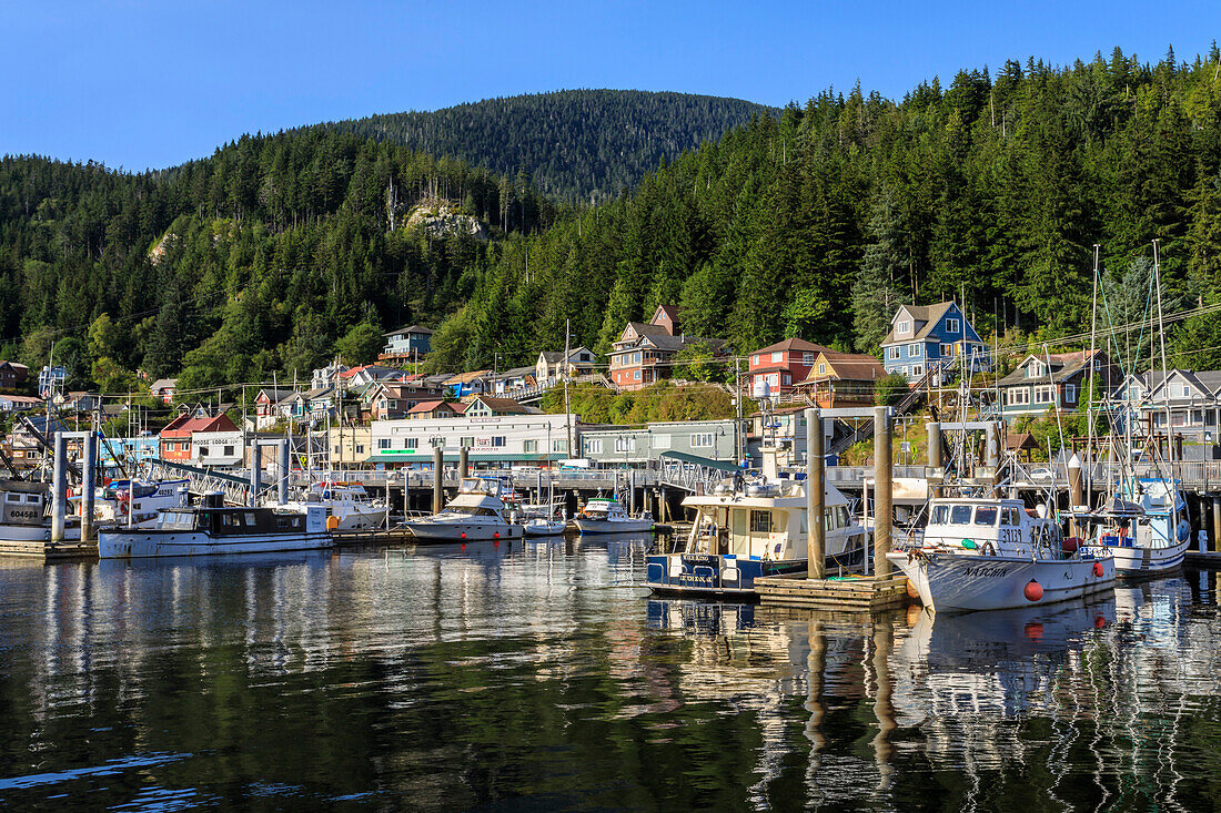 Commercial fishing boats, town and forest, beautiful sunny summer day, Ketchikan waterfront, Southern Panhandle, Alaska, United States of America, North America