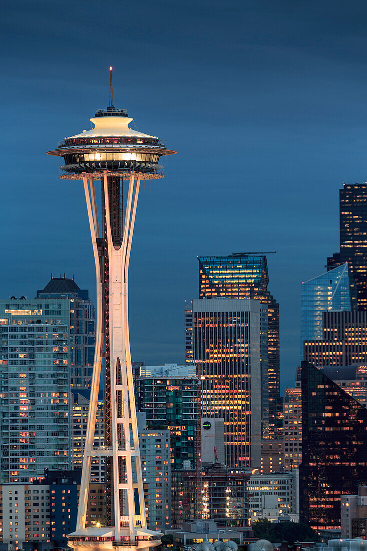 Seattle city skyline at night with illuminated office buildings and Space Needle viewed from public garden near Kerry Park, Seattle, Washington State, United States of America, North America