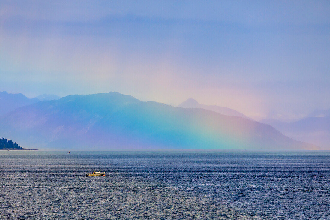 Boat, huge rainbow colours light up mist over the Fairweather Range, Icy Strait, near Glacier Bay, Inside Passage, Alaska, United States of America, North America