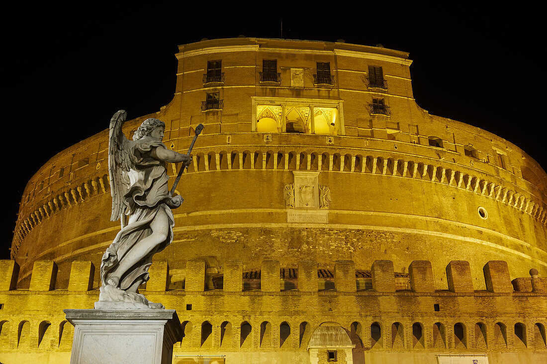 Castel Sant'Angelo facade at night with statue on Ponte Sant'Angelo, UNESCO World Heritage Site, Rome, Lazio, Italy, Europe