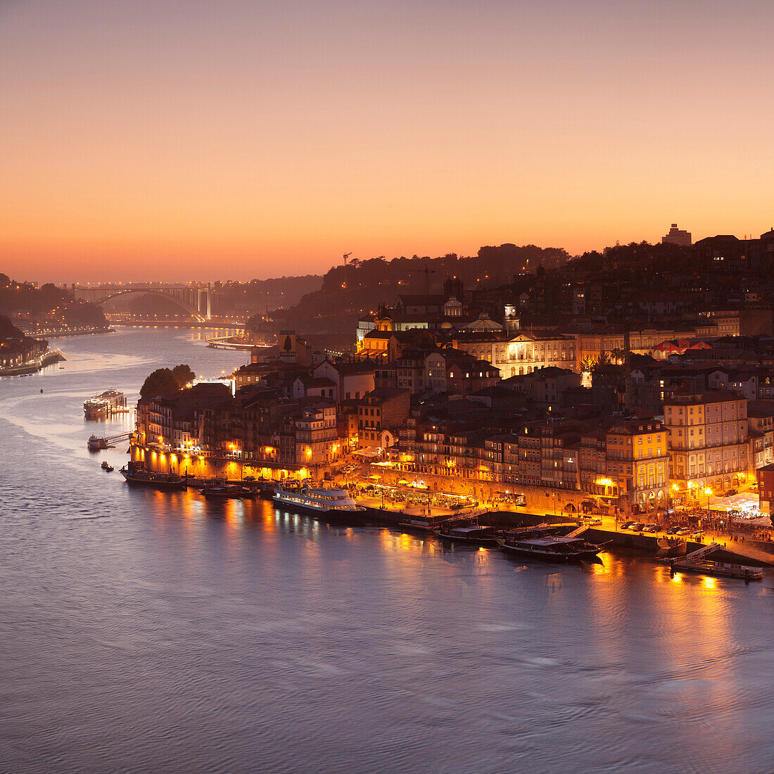 View over Douro River at sunset to Ribeira District, UNESCO World Heritage Site, Porto (Oporto), Portugal, Europe