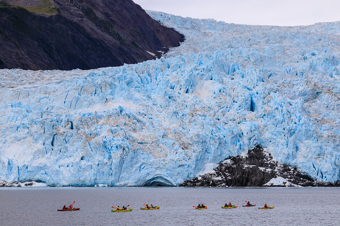 Colourful kayaks, Aialik Glacier, blue ice and mountains, Harding Icefield, Kenai Fjords National Park, near Seward, Alaska, United States of America, North America