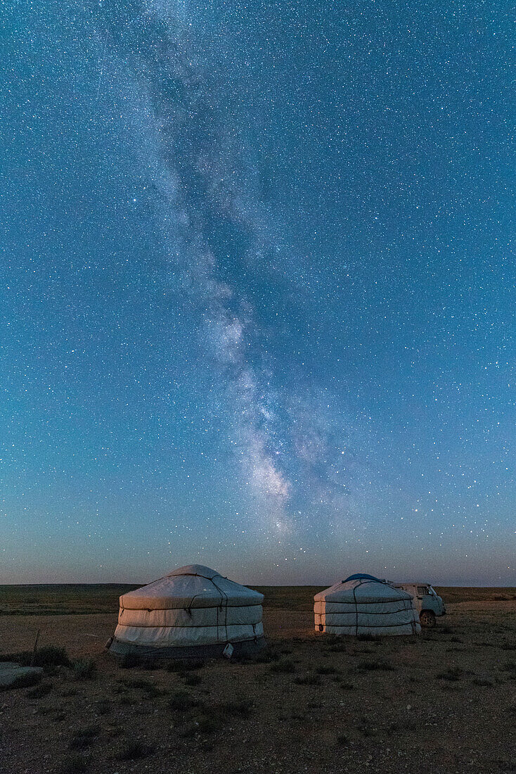 Mongolian traditional gers under the Milky Way, Ulziit, Middle Gobi province, Mongolia, Central Asia, Asia